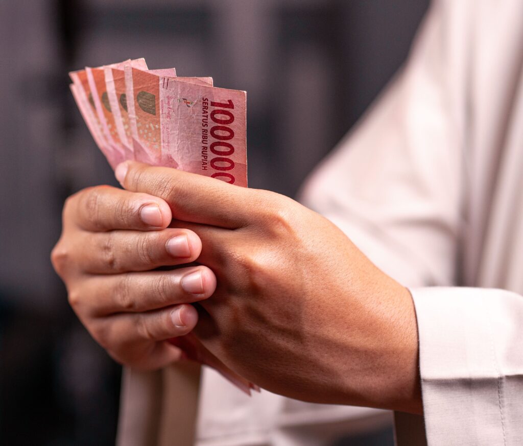 Indonesian Rupiah banknotes received after a foreign currency exchange transaction in Bali, Indonesia.
