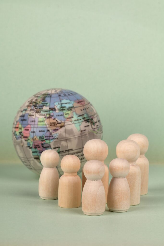Global figures beside world map representing international confidence as S&P affirms Indonesia's BBB credit rating