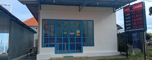 Cash X Change authorized money changer storefront in Kelingking Beach, Nusa Penida